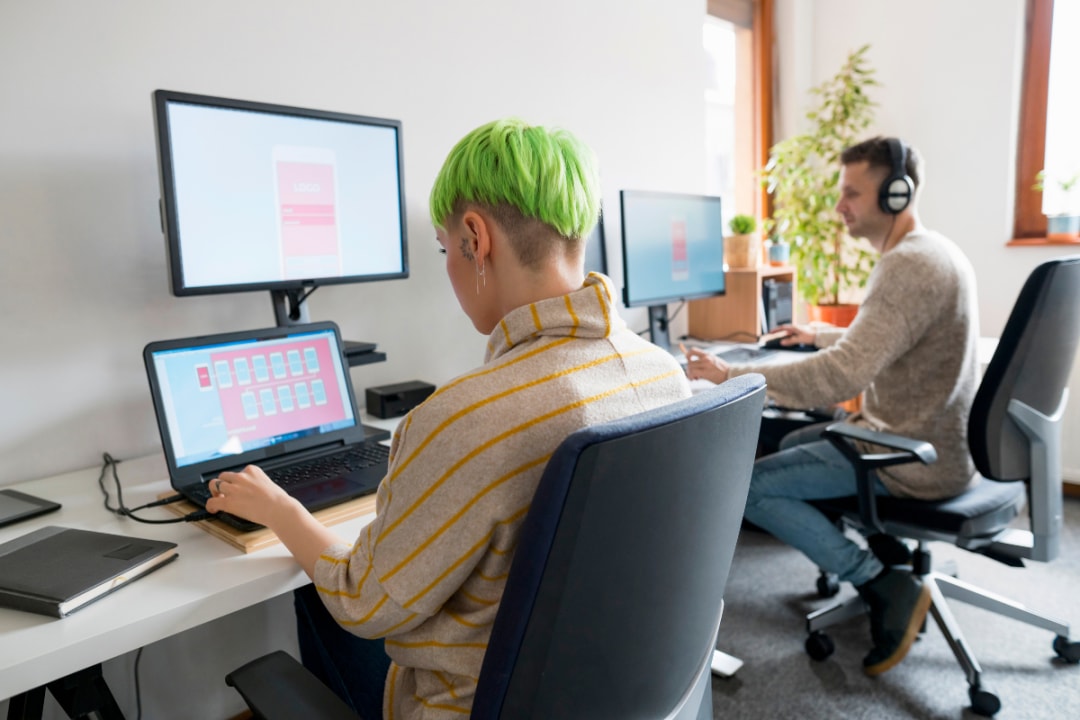 2 Adults working in shared space