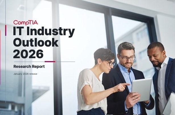 IT Industry Outlook 2026 - group of co-workers gathers around handheld device