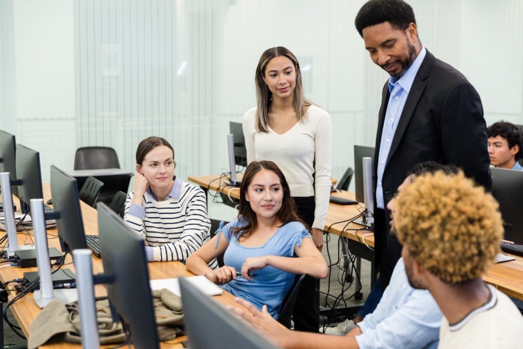 Teacher talking with students
